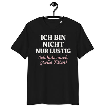 schwarzes T-Shirt mit Spruch ich bin nicht nur lustig ich habe auch große Titten, zweizeilig, rosa Schreibschrift im Klammerzusatz