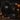 Dunkle Halloween Merch-Kollektion von Nyrra Merch System mit Hoodie, T-Shirt, Tasche und Tasse vor Kürbissen und Kerzenlicht. Die Szene zeigt saisonale Halloween Special Editions für Events, Erlebnisbetriebe und herbstliche Aktionen.