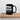schwarze Tasse mit Illustration eines Triebwagens in Frontansicht, creme-blaues Design, technischer Stil
