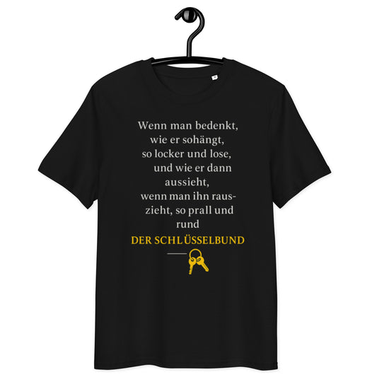 schwarzes T-Shirt mit Spruch über etwas das hängt, prall wird und herausgezogen wird, Auflösung der Schlüsselbund, gelbes Schlüssel-Icon
