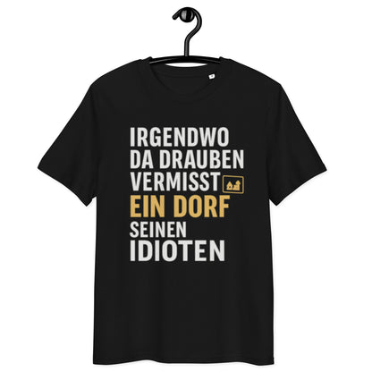 schwarzes T-Shirt mit Spruch irgendwo da draußen vermisst ein dorf seinen idioten in weiß und gold, kleines Dorf-Icon
