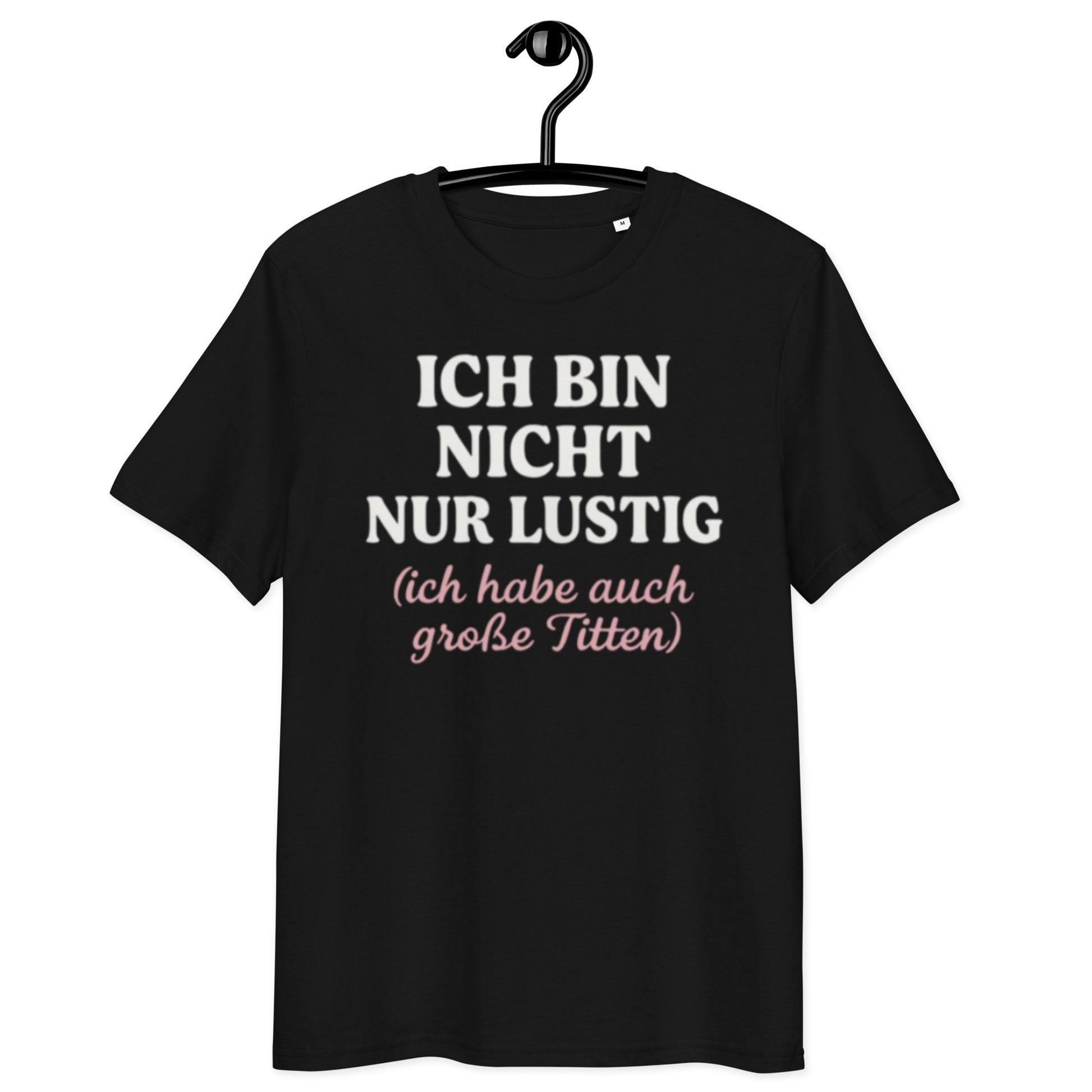 schwarzes T-Shirt mit Spruch ich bin nicht nur lustig ich habe auch große Titten, zweizeilig, rosa Schreibschrift im Klammerzusatz
